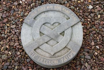 Heart of Robert the Bruce, with modern marker. Ruins of Melrose Abbey, Melrose, Scotland.