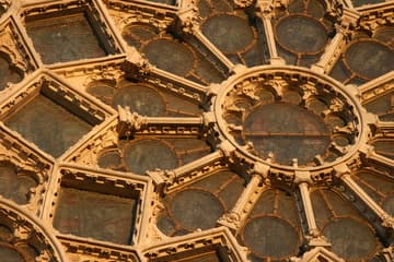 Exterior of the 13th-century north rose window at sunset.