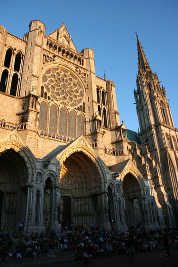 Evening view of the 13th-century north transept and its portal, which has a theme of the Old Testament.