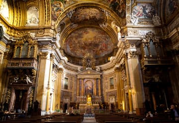 Interior view from the small transept, looking east to the apse and altar. Il Gesu, the mother church of the Jesuits, 16th century. Rome, Italy.