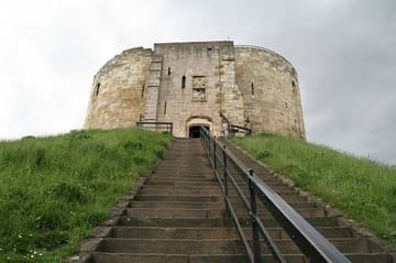 The fortress now known as Clifford's Tower in York was originally built by William the Conquerer in 1068, as part of his campaign to subdue the North under Norman rule. A century later it became the site of terrible anti-Jewish violence in which many lost their lives. York, England.