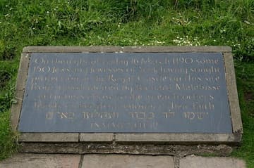 Memorial plaque at Clifford's Tower in York, which reads: "On the night of Friday 16 March 1190 some 150 Jews and Jewesses of York having sought protection in the Royal Castle on this site from a mob moved by Richard Malebisse and others chose to die at each other's hands rather than renounce their faith. Isaiah XLII 12."