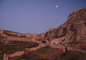 Fortress of Acrocorinth at dusk, with full moon.