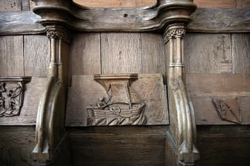 Misericord (c.1480) in the choir of the Oude Kerk, Amsterdam, Netherlands. It illustrates the proverb, "Sail when the wind allows."