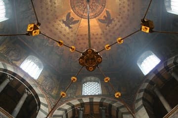 The octagonal dome with mosaics (clouded with incense following a service) from beneath Barbarossa's chandelier.