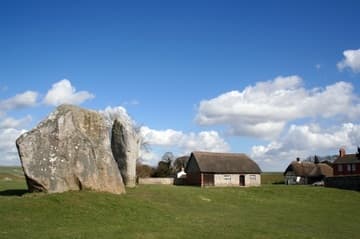The stones of "the Cove," with a village barn in the background. The Cove is inside the Northern Inner Circle and may have been aligned on the moon's northernmost rising point. Avebury Henge, c.2600-2400 BC, Wiltshire, England.