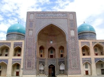 The blue-tiled facade of the medressa.