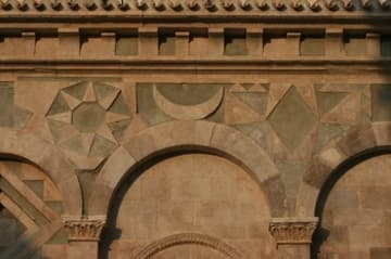 Crescent moon and sun designs on the south exterior.