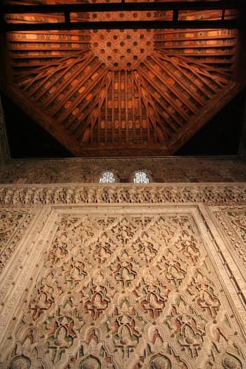 End wall and cedar ceiling, both richly carved.
