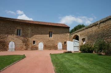 Priory wall and buildings to the west of the church.
