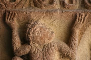 Corbel with atlas figure on the west door.