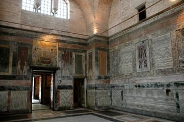 Interior view of the central sanctuary or nave, looking towards the entrance. Over the door is a mosaic of the Dormition of the Virgin.