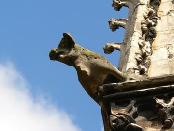 A stone pig watches from high atop a pinnacle on the southeast side.
