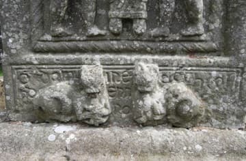 Cats and identifying inscription on the western base of Muirdach's Cross (900-923 AD). The inscription reads "A prayer for Muirdach for whom (or by whom) the cross was made."