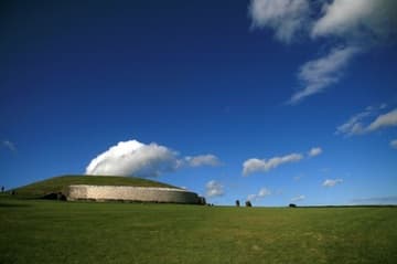 A cloud passes over the passage tomb at Newgrange.
