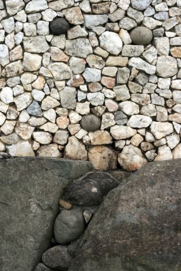Detail of quartz facade with granite stones at Newgrange, a prehistoric passage tomb and ceremonial chamber dating from about 3200 BC. Boyne River Valley, County Meath, Ireland.