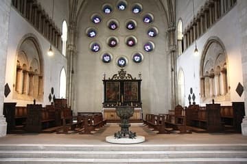 The west work is the oldest part of the present cathedral, dating from the 1100s. A small, elevated west choir (seen here) occupies the central area. The west wall with its round windows is a controversial design of the 1950s, but the remainder has many historical features. The side walls are decorated with original blind arcades, the choir stalls date from the 1500s, the fine Baroque altarpiece was made in 1619-22 by Gerhard Gr