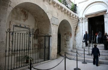 Lower atrium, with Romanesque portal leading into the grotto.