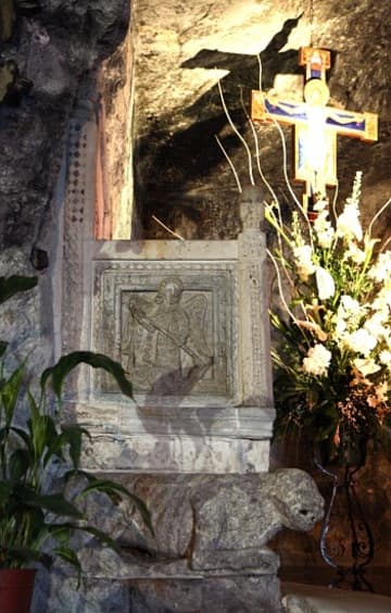 Episcopal throne (11th century) with early medieval relief of St. Michael.