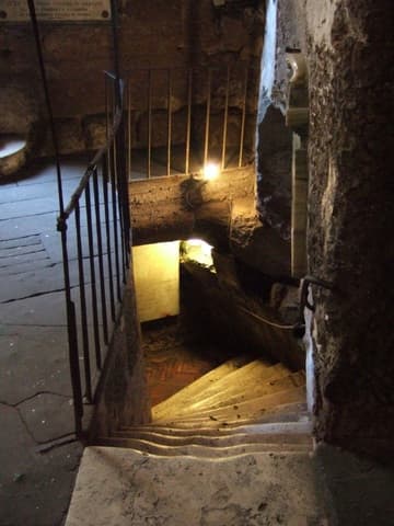 The modern but well-worn stairs to the lower room of the prison, where St. Peter and Paul are believed to have stayed. A stone at the top of these stairs is said to bear the imprint of Peter's head.