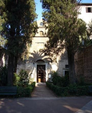 The shady entrance to the ancient church.