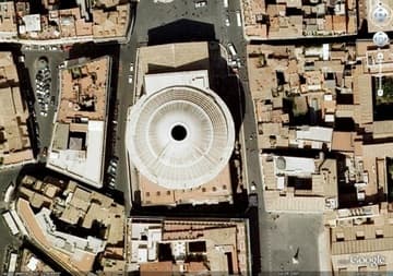 Aerial view of the Pantheon. The temple's entrance is on the plaza on the north side; the church and plaza of Santa Maria sopra Minerva can be seen on the Pantheon's lower right corner.