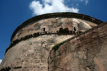 West side of the great Pantheon in Rome. The first temple on this site was founded in 27 BC by Marcus Agrippa, who is given credit for the building on the portico inscription. But the Pantheon was completely reconstructed in 125 AD by Hadrian, a cosmopolitan emperor who had traveled widely in the East. Hadrian himself is credited with the basic plan, an architectural design that was unique for the time.