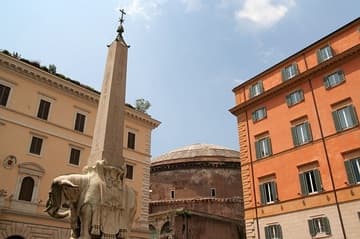 View of the east side of the Pantheon from the Piazza Santa Maria sopra Minerva, with Bernini's elephant supporting an Egyptian obelisk in the foreground. The first temple on this site was founded in 27 BC by Marcus Agrippa, who is given credit for the building on the portico inscription. But the Pantheon was completely reconstructed in 125 AD by Hadrian, a cosmopolitan emperor who had traveled widely in the East. Hadrian himself is credited with the basic plan, an architectural design that was unique for the time.