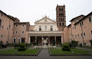 Atrium and east facade (1725) of Santa Cecilia. The tower dates from the 9th century.