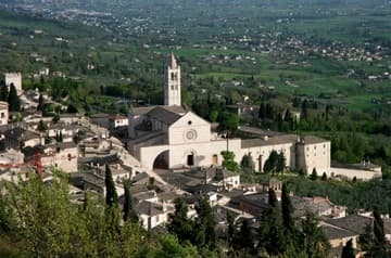 Bird's-eye view of Santa Chiara (built 1260) and the Umbrian valley from the Rocca Maggiore. Assisi, Italy.