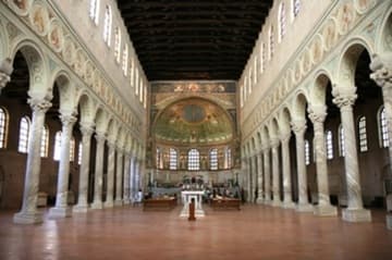 Nave looking east. The basilica has a tall and wide nave with side aisles. There are 58 wide windows, including five in the apse, which flood the interior with light. The nave is supported on two dozen slender marble columns topped with Byzantine carved capitals. These are not ancient spoils, but a perfectly matched set made specifically for the church in the imperial workshop of Proconnesos.