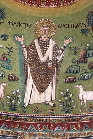At the bottom of the 6th-century apse mosaic is the namesake of the basilica labeled with the inscription SANCTVS APOLENARIS. He is shown in prayer, interceding on behalf of his flock who are represented below by lambs. This is the first known example of choosing a subject other than Christ in Majesty for the apse decoration. Around the saint is a soft green backdrop populated with rocks, birds, and plants. Among the greenery are pine trees, which can still be seen growing outside the church.