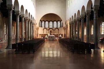 Nave of San Giovanni Evangelista in Ravenna, looking east to the apse. The basilica was built c.426-30 by Galla Placidia in fulfillment of a vow. It was badly damaged by bombs in 1944 but rebuilt to its original Byzantine form. Most of the columns and capitals are original. The triumphal arch and apse were once covered with important mosaics depicting the family of Theodosius and Galla Placidia being saved from the storm at sea, but they were tragically removed in the 16th century.
