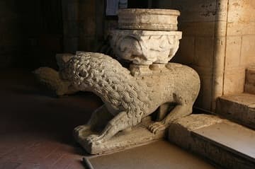 Lion statue just inside the west portal of the Abbey of Sant'Antimo in Tuscany. Said to have been founded by Charlemagne in 781, the present abbey church dates from 1118.