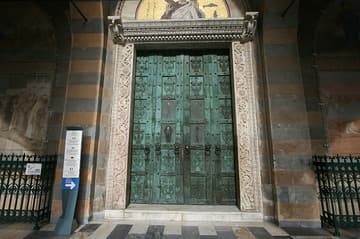 Amalfi Cathedral's medieval bronze doors were the first to appear in Italy. Commisioned by a wealthy merchant of Amalfi, they were cast in Constantinople around 1060 by Simeon of Syria (he signed his work). Remains of silver inlays depicting Christ, Mary, and various saints can still be seen.