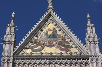 Upper facade detail with 19th-century Coronation of the Virgin mosaic.