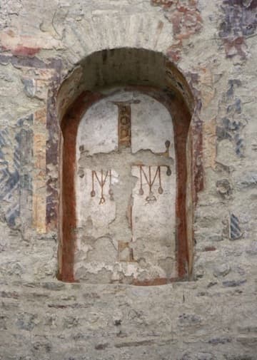 Fresco of a cross with hanging gemstones from the 8th century.