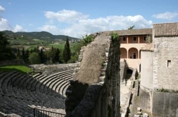 View of the Romanesque church that now houses the Archaeological Museum (right) and the 1st-century Roman theater (left) from above.
