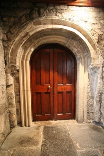 Romanesque door between porch and parish church.