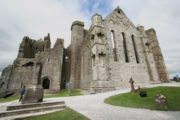 View of cathedral from south, with tower-house at the west end (left, 15th century) and south transept with lancet windows (right, 13th century). Rock of Cashel, County Tipperary, Ireland.