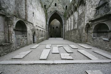 Interior of the cathedral, looking west. The cathedral was built 1235-70 and the tower-house at the west end was added in the 15th century. Rock of Cashel, County Tipperary, Ireland.