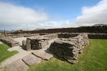 The square oratory, with cross-inscribed stone near the entrance.
