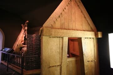 Replica of wooden church and cross carving workshop in the museum.