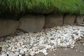 Quartz facade and decorated kerbstones near eastern passage.