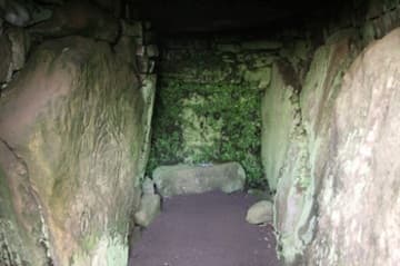 Short passage in the Mound of the Hostages, with carving on the left.