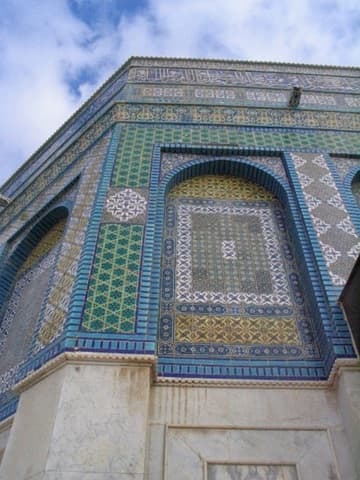 Another view of the white marble (below) and colorful tilework (above) on the exterior of the Dome of the Rock.