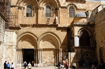 Exterior facade and main entrance to the Church of the Holy Sepulchre. The Chapel of the Franks is under the small dome on the right.