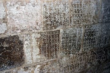 In the stairway to the Chapel of St. Helen, a multitude of crosses carved into the wall by medieval pilgrims.