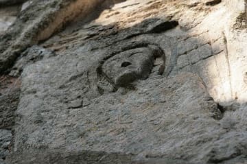 10th-century angel carved high on the ruined apse.