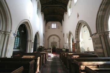 Nave looking east, past Early English arcades to the Saxon chancel arch.